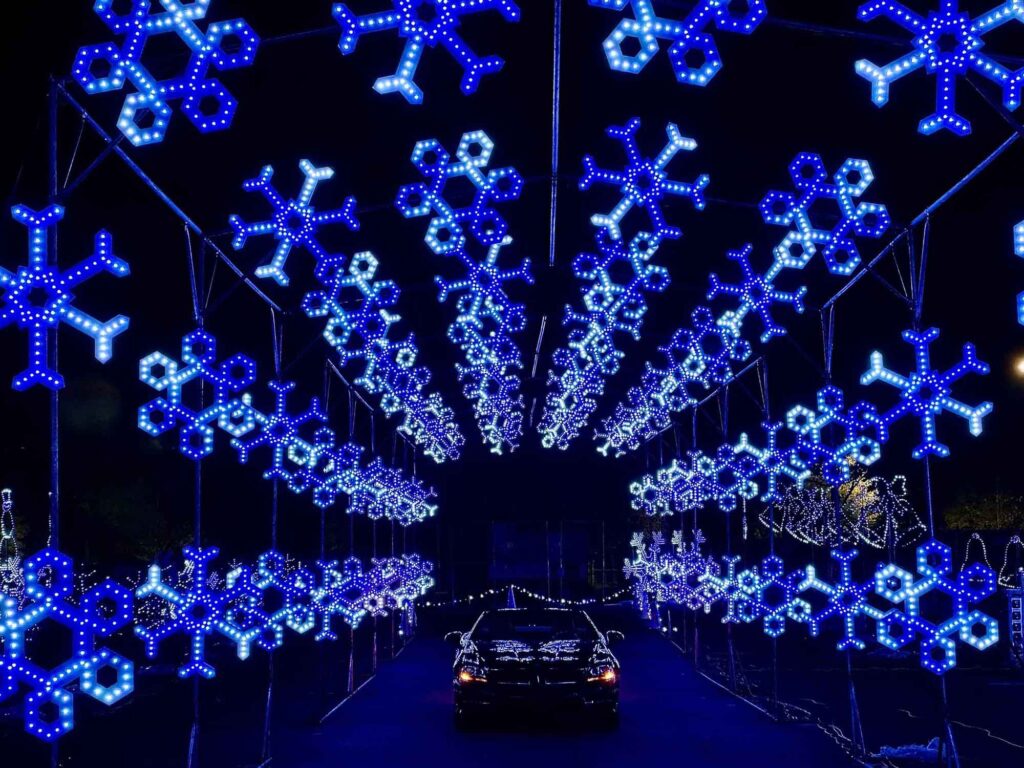 Tunnel of lights in the shape of snowflakes.